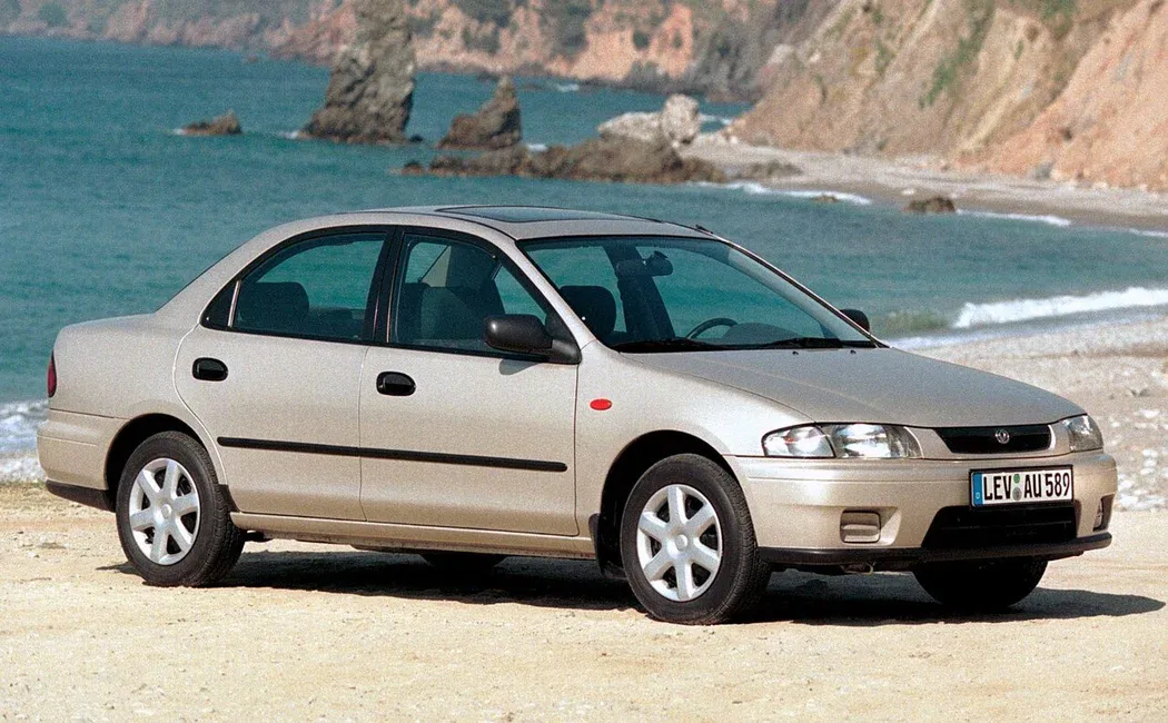 Логотип Mazda 323 Седан 4 дв. 5 (BA)