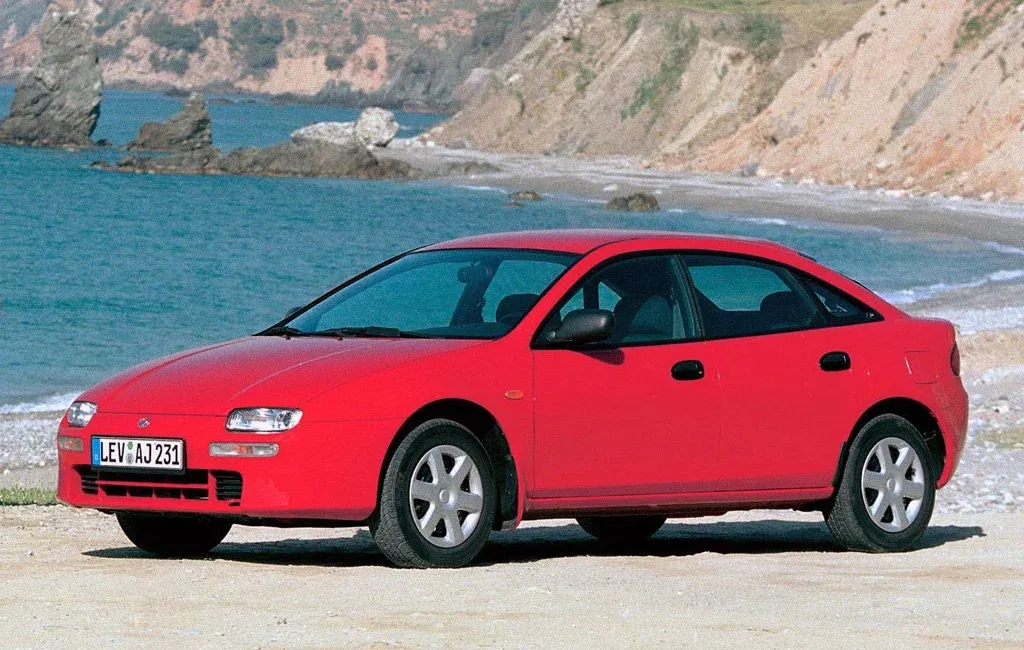 Логотип Mazda 323 Хэтчбек 5 дв. 5 (BA)