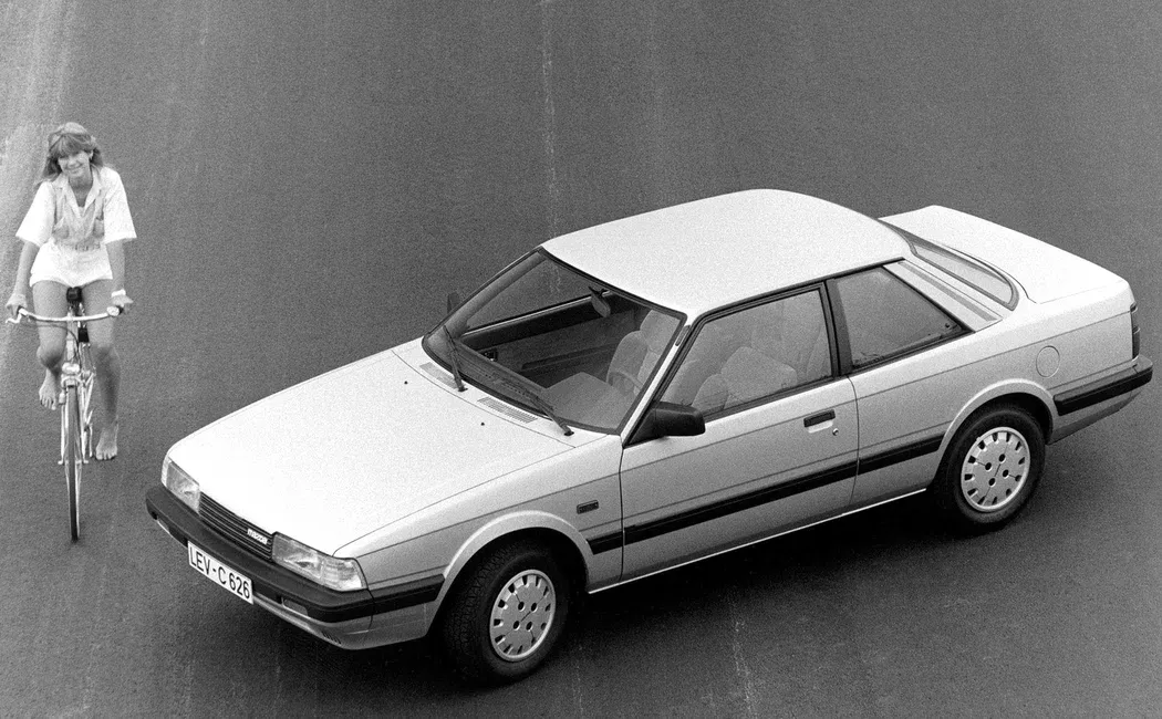 Логотип Mazda 626 Купе 2 дв. 2 (GC)