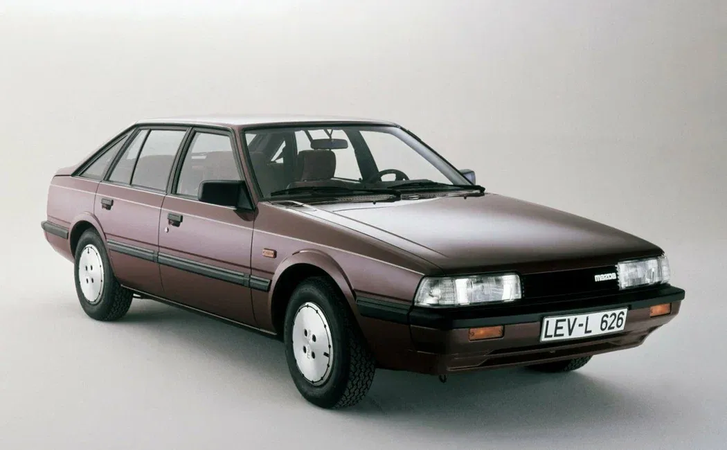 Логотип Mazda 626 Лифтбек 4 дв. 2 (GC)