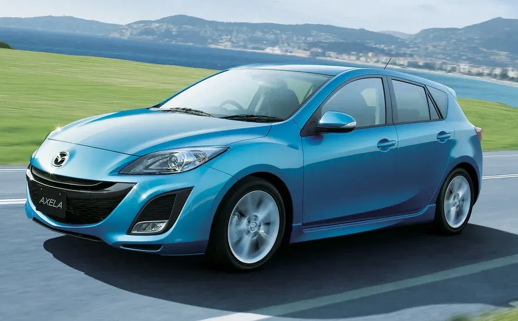 Логотип Mazda Axela Хэтчбек 5 дв. 2 поколение