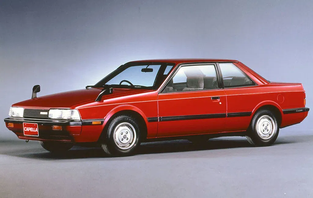 Логотип Mazda Capella Купе 2 дв. 3 поколение