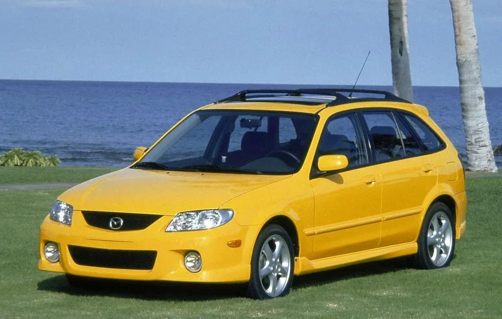 Логотип Mazda Protege Хэтчбек 5 дв. (BJ)