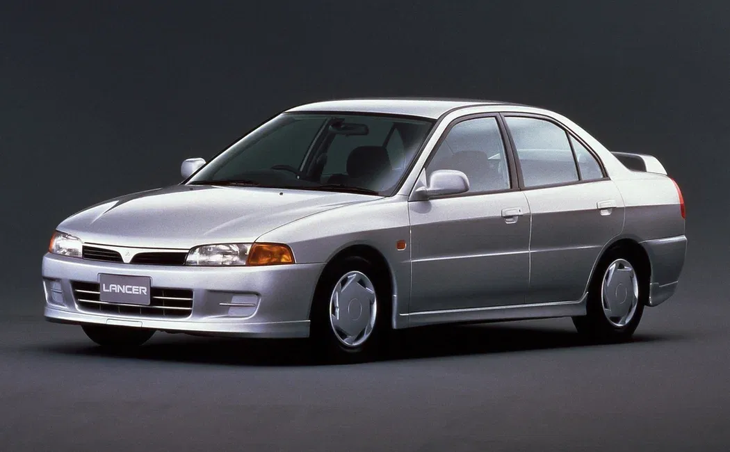 Логотип Mitsubishi Lancer Седан 4 дв. 7 поколение