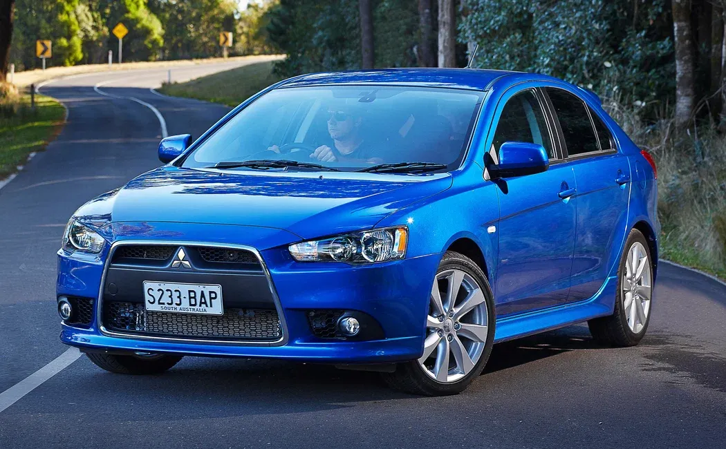 Логотип Mitsubishi Lancer Хэтчбек 5 дв. 10 поколение