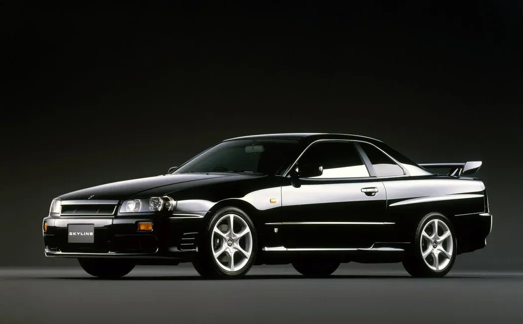 Логотип Nissan Skyline Купе 2 дв. 10 (R34)