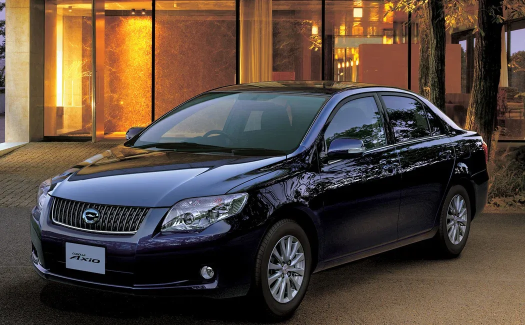 Логотип Corolla Axio NZE144